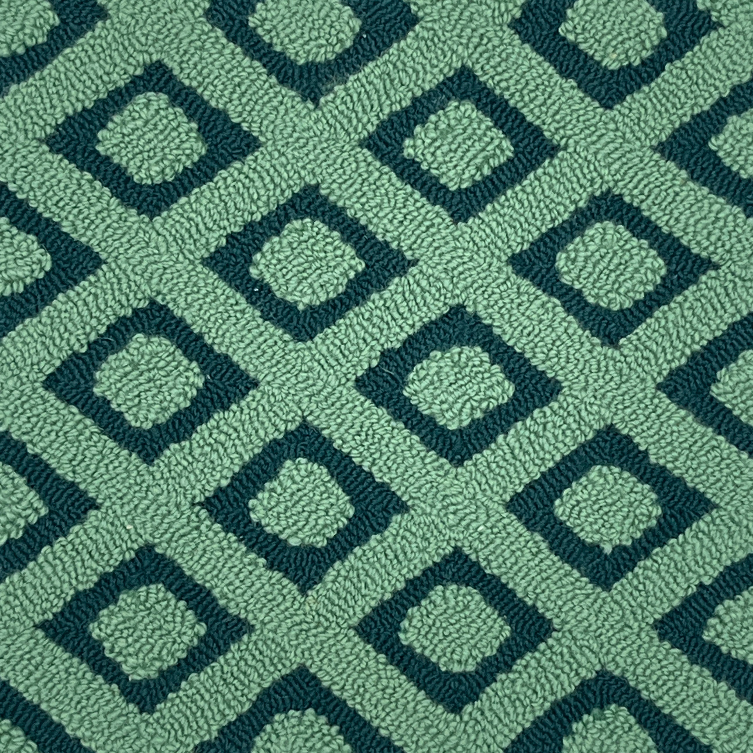 Patterned green rug with geometric design