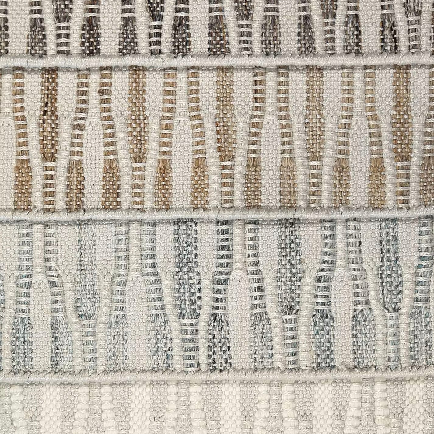 Stack of broadloom carpet samples in a flatwoven wavy stripes. 