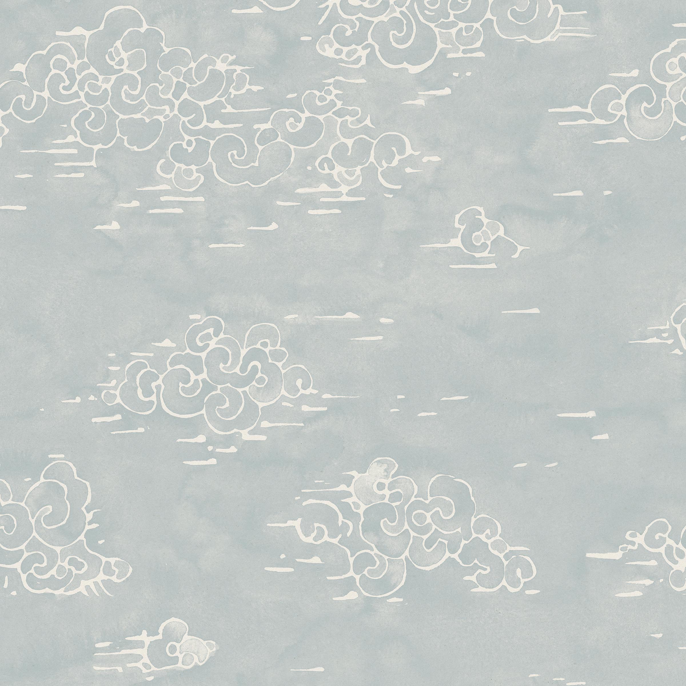 Detail of fabric in a painterly cloud pattern in white on a sky blue field.