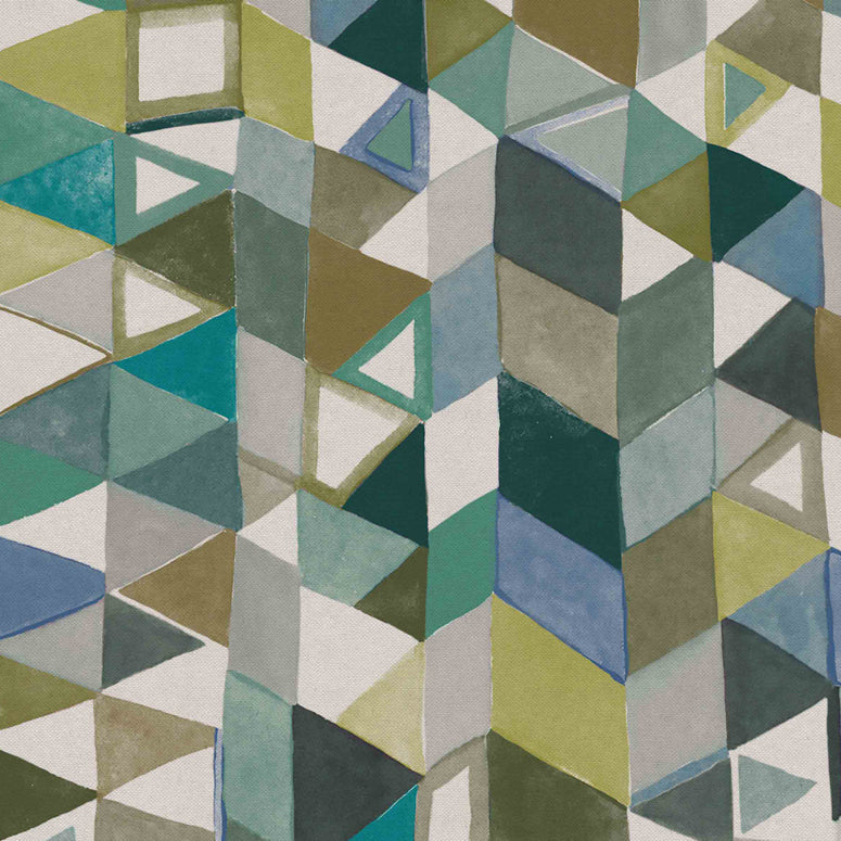 Detail of fabric in a playful repeating geometric print in shades of blue, green, white and brown.