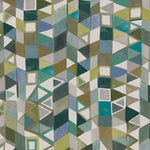 Detail of fabric in a playful repeating geometric print in shades of blue, green, white and brown.