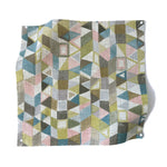 Square fabric swatch in a small-scale playful geometric print in shades of pink, purple, green and 