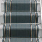 Striped flatweave runner in blue on white staircase