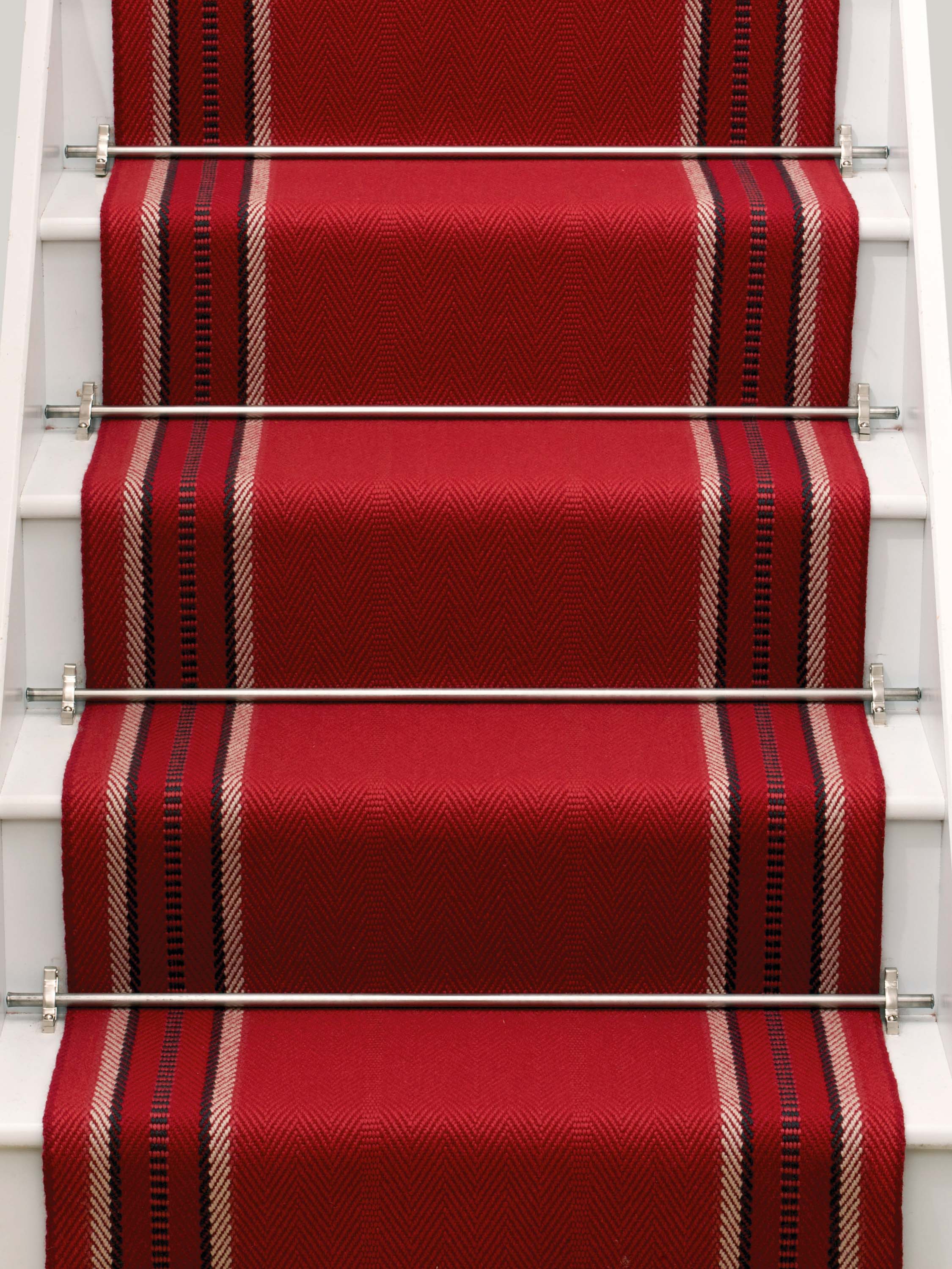 Striped flatweave runner in red on white staircase