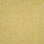 Fabric in a dappled animal print in shades of olive and mustard on a cream field.