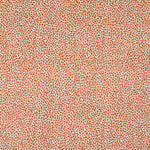 Fabric in a dappled animal print in shades of red and tan on a cream field.