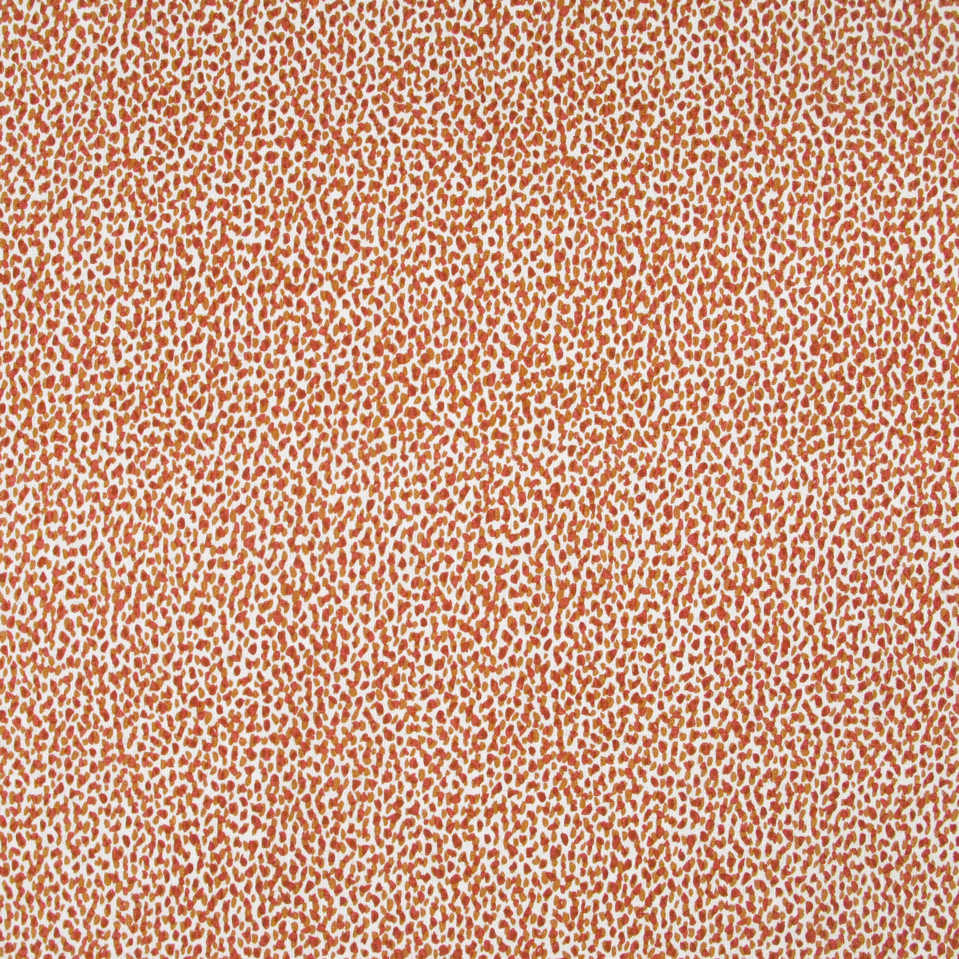 Fabric in a dappled animal print in shades of red and tan on a cream field.