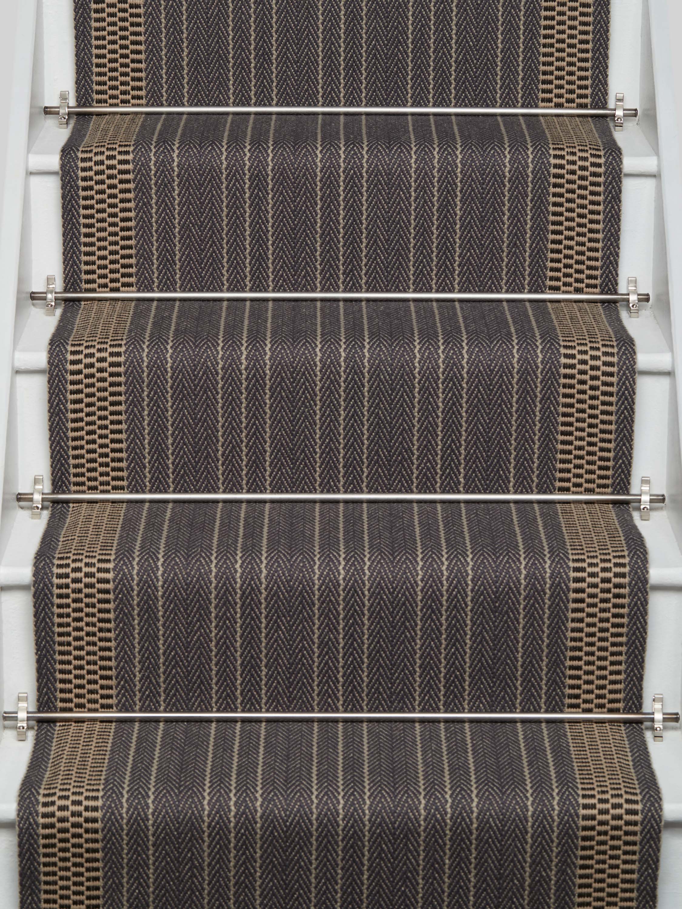 Striped flatweave runner in charcoal and ivory on white staircase