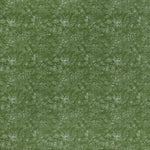 printed linen fabric in a dotted leaf pattern in white on a green field.