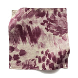 Square fabric swatch in a painterly cloud print in shades of maroon on a cream field.