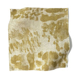 Square fabric swatch in a painterly cloud print in shades of mustard on a cream field.