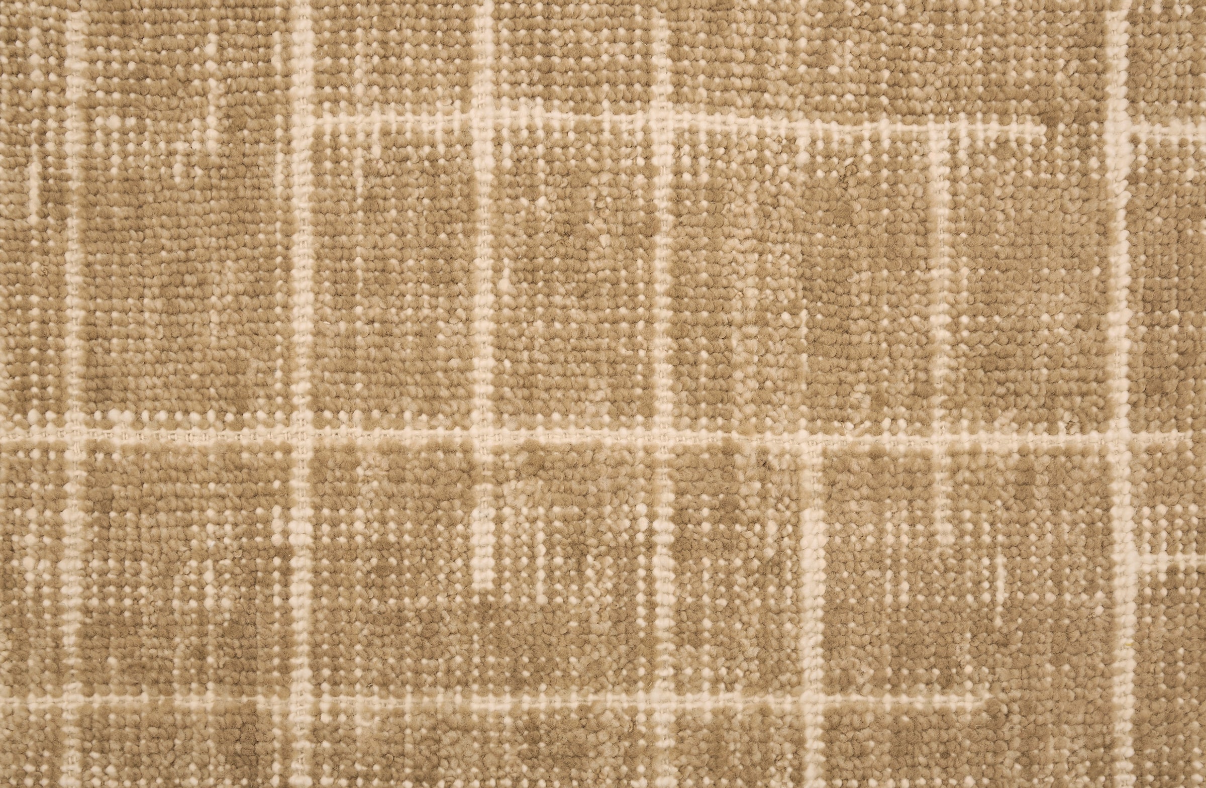 Textured carpet with a checkered pattern in tan and beige tones.