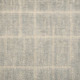 Textured carpet with a checkered pattern in gray and beige tones.