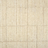 Textured carpet with a checkered pattern in cream tones.