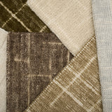 Close-up of textured carpet samples in brown, beige, and gray.