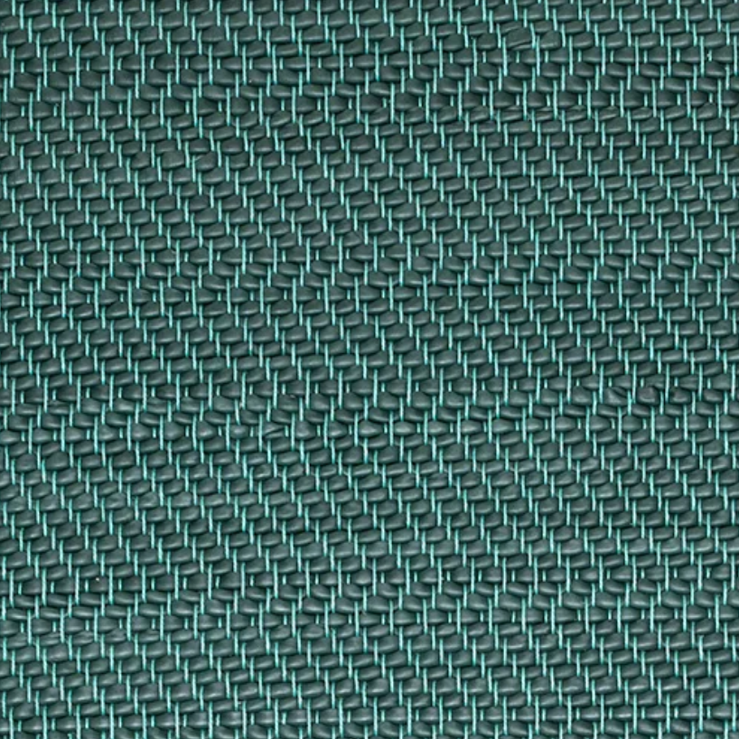 Detail of a woven leather rug in a herringbone pattern in dark green with turquoise accents.