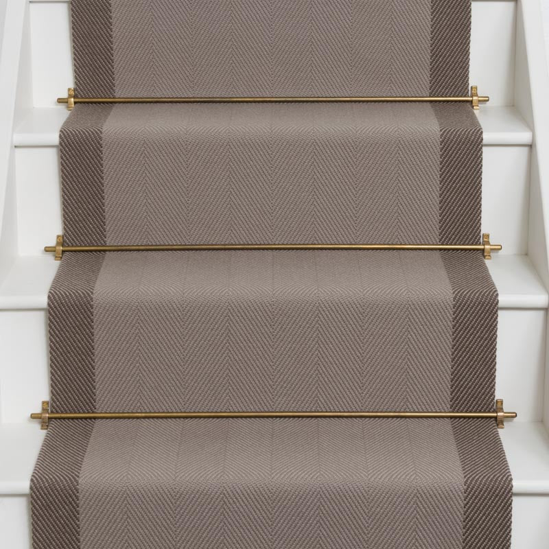 Herringbone flatweave runner in grey and brown on white staircase