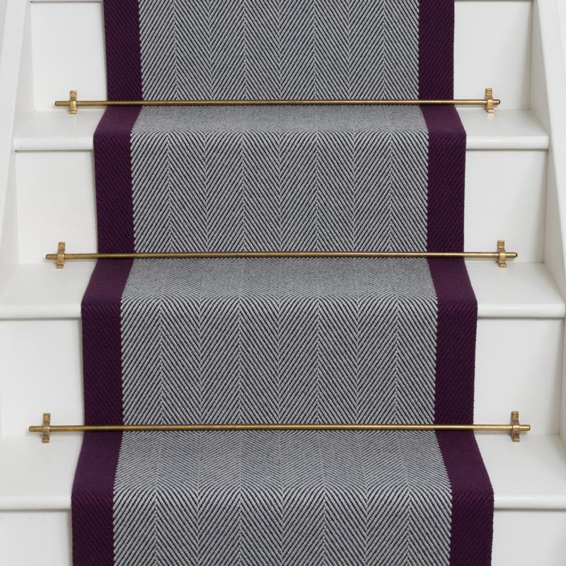 Herringbone flatweave runner in grey and purple on white staircase