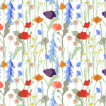 Detail of wallpaper in a painterly floral print in a rainbow of shades on a white field.