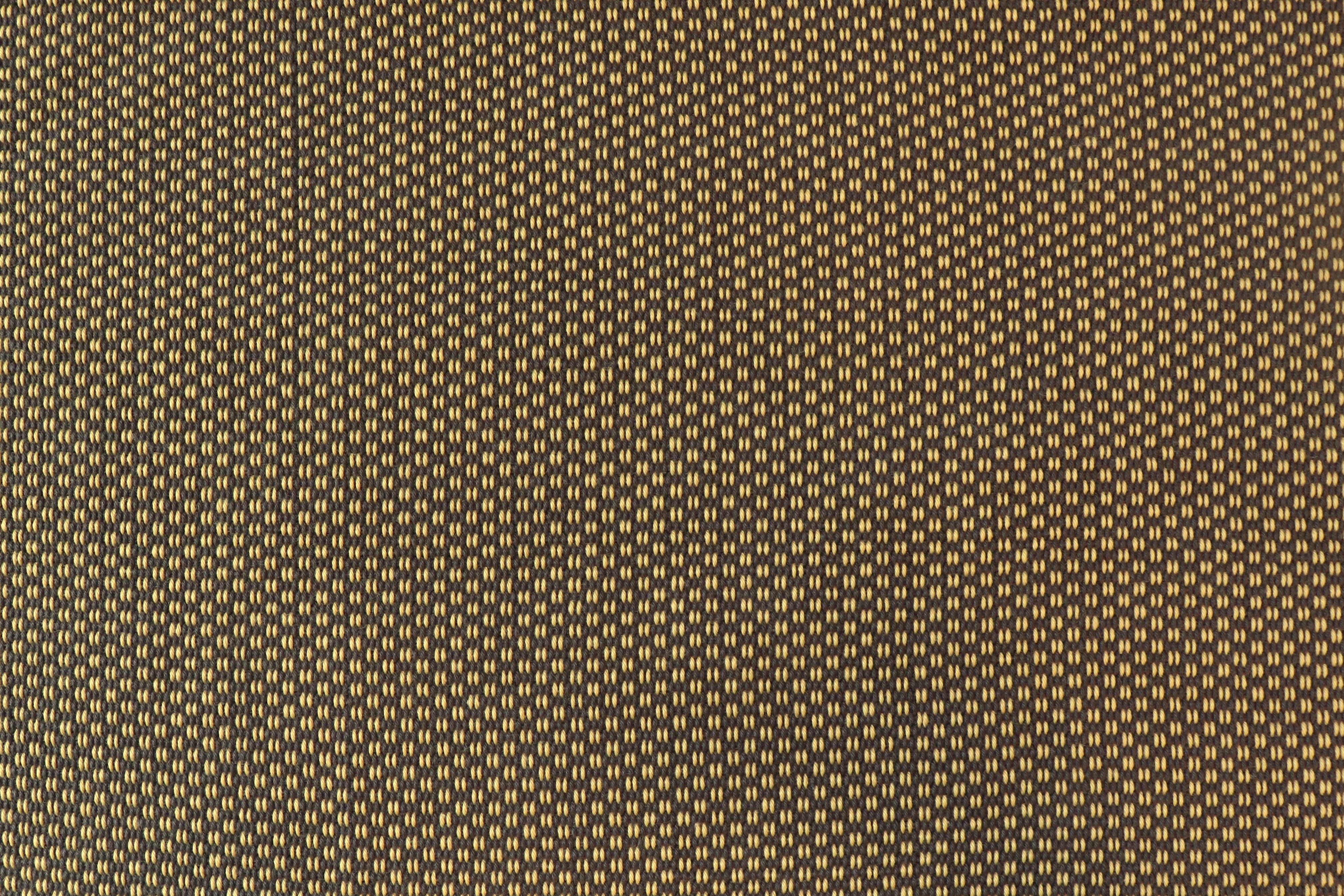 Handwoven fabric in a brown and yellow texture