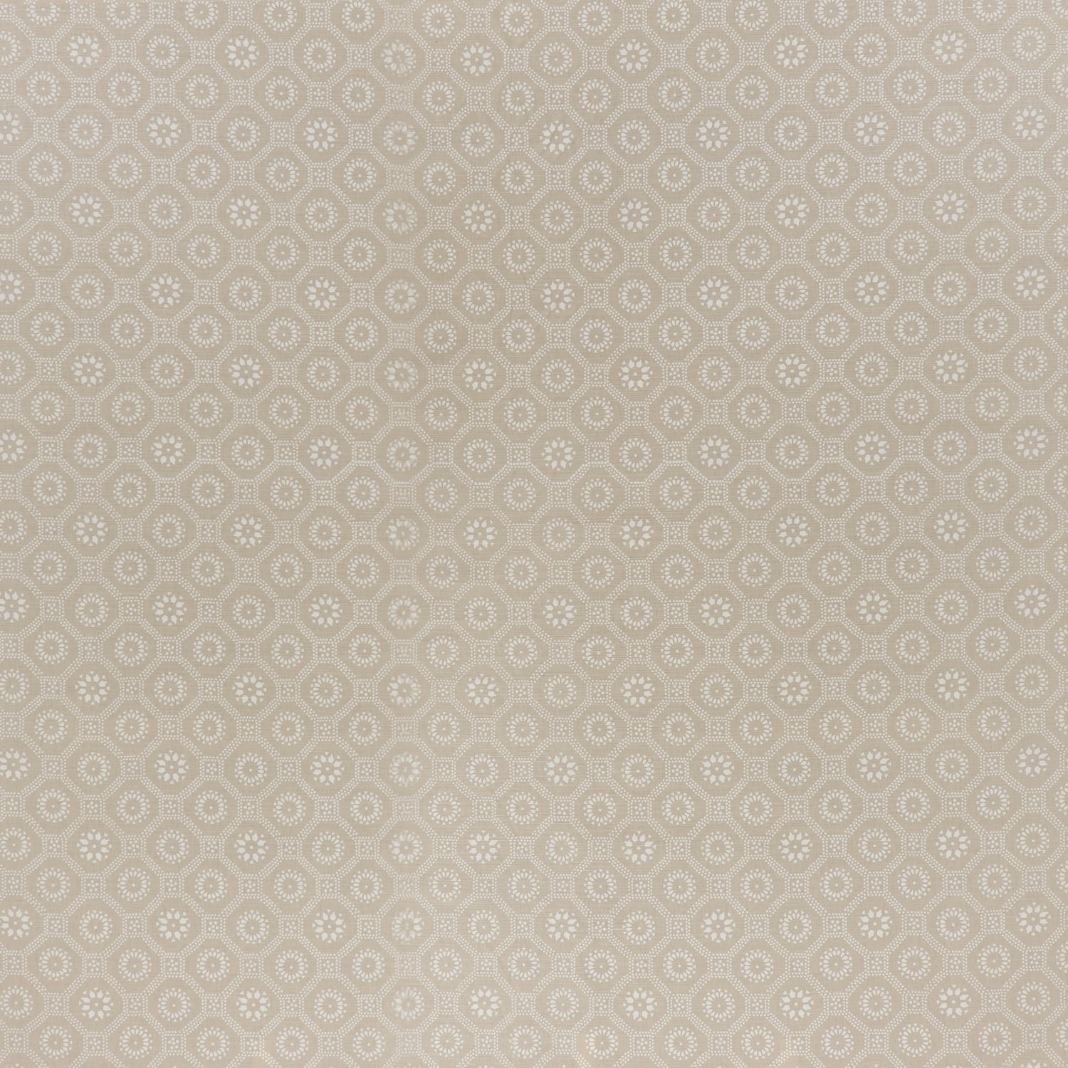 printed cotton fabric in a floral gridded honeycomb pattern in white on a beige field.