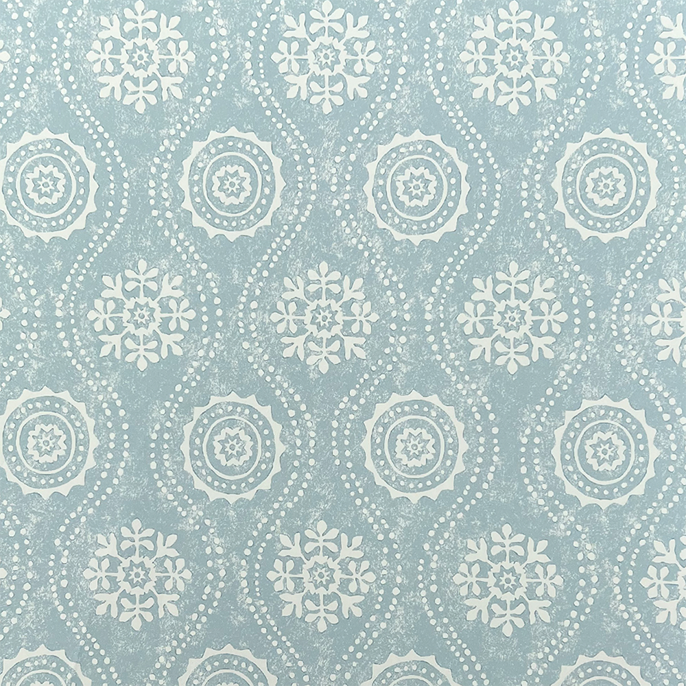 Detail of wallpaper in a playful floral stripe in cream on a blue-gray field.