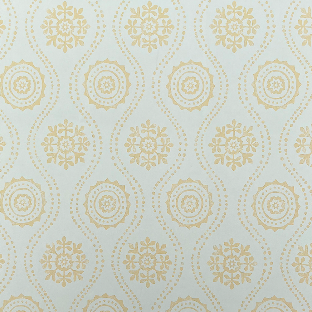 Detail of wallpaper in a playful floral stripe in yellow on a gray field.