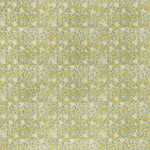 printed linen fabric in a painterly floral pattern in mustard and blue on a cream field.