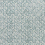 printed linen fabric in a painterly floral pattern in shades of blue on a cream field.