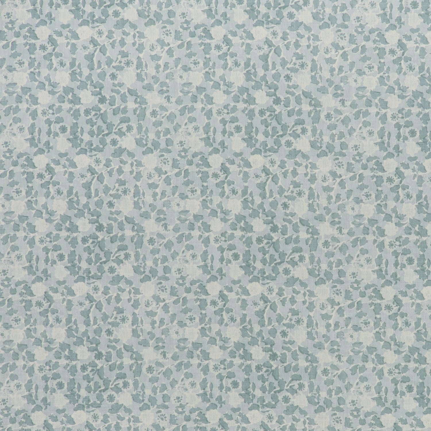 printed linen fabric in a painterly floral pattern in shades of blue on a cream field.