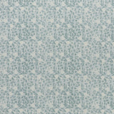 printed linen fabric in a painterly floral pattern in shades of blue on a cream field.