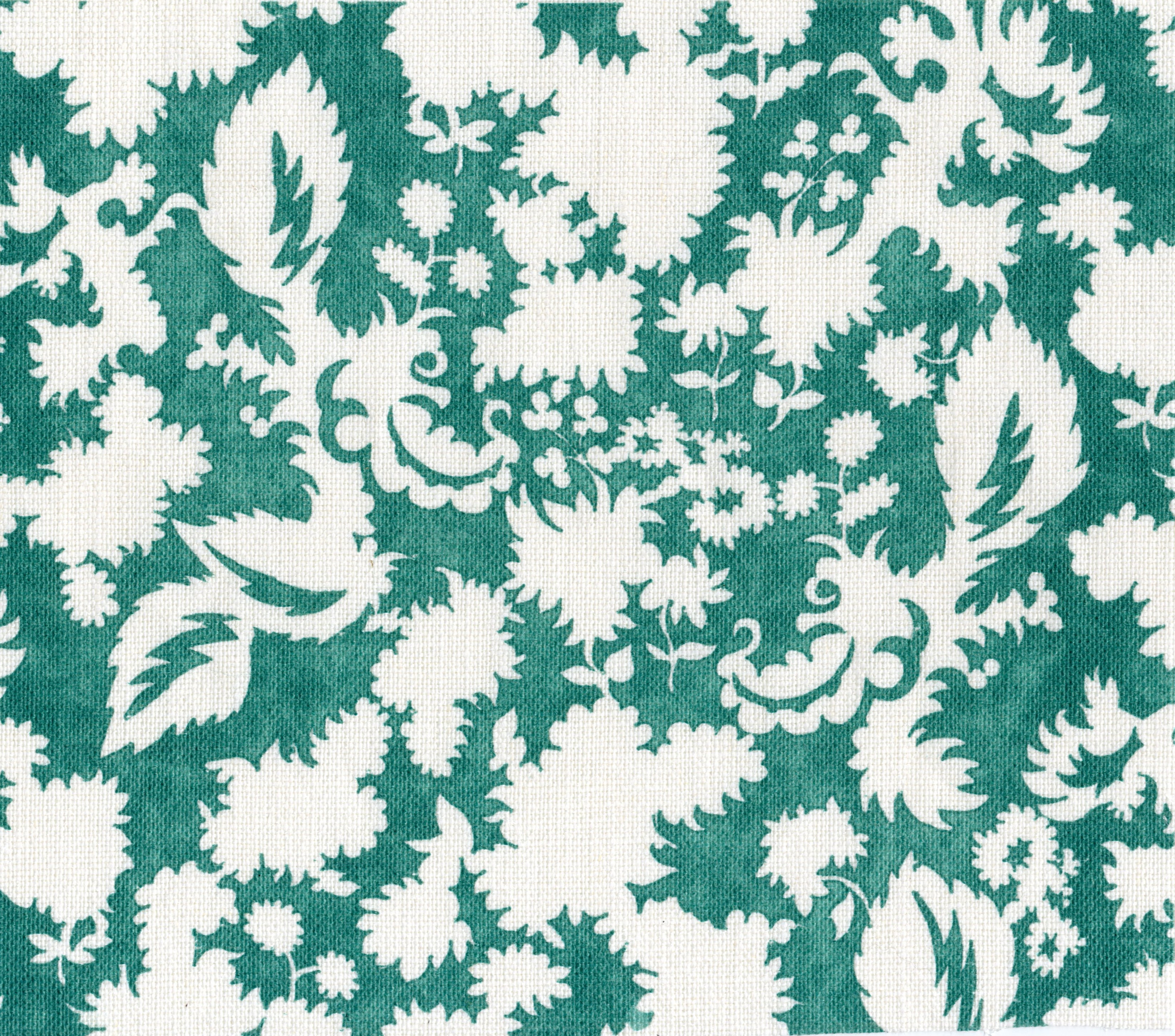 Printed linen in a white floral silhouette motif on emerald green field. 