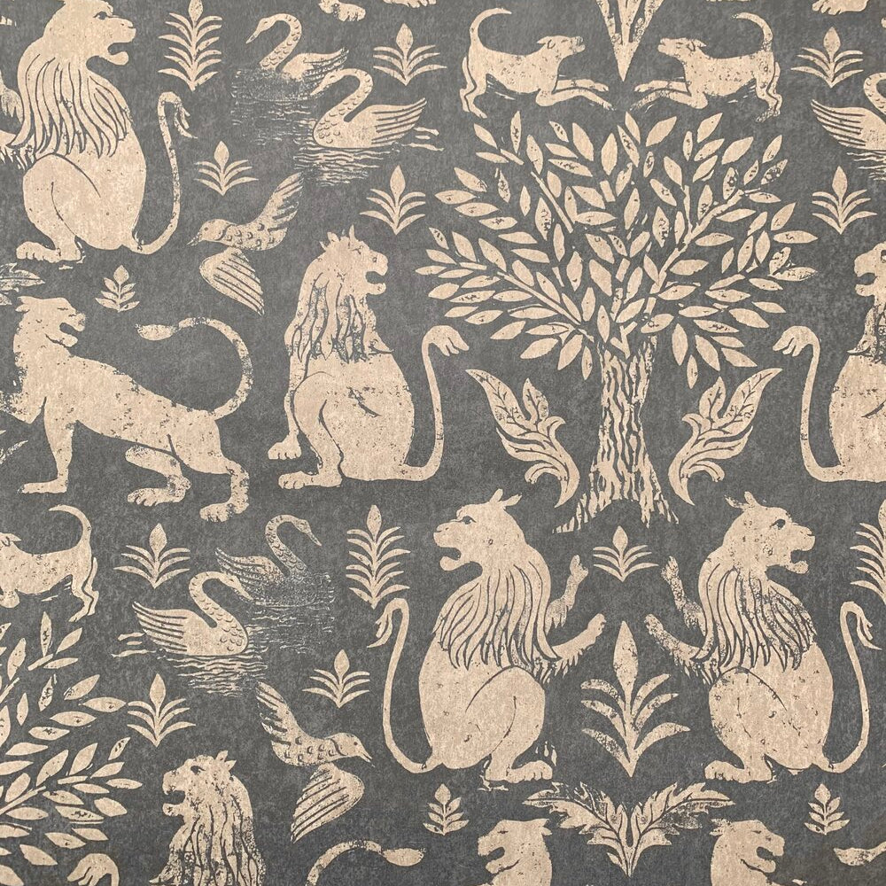 Detail of wallpaper in a lion and plant print in cream on a mottled gray field.