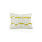 Rectangular throw pillow with an embroidered wave pattern in yellow and white on a repeating cream and greige diamond field.