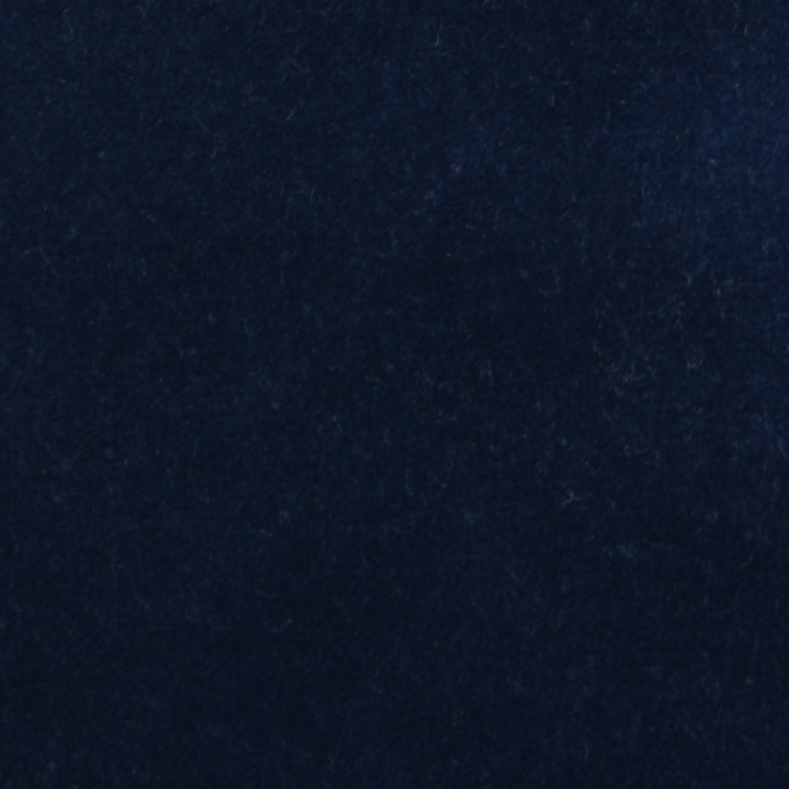 Detail of velvet fabric yardage in indigo.