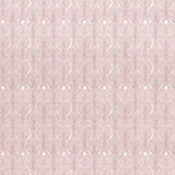 Detail of wallpaper in an art deco damask print in pink on a white field.