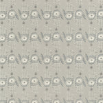 Detail of wallpaper in a playful hamsa hand print in cream and gray on a tan field.