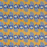 Detail of wallpaper in a playful hamsa hand print in blue, yellow and orange on a yellow field.