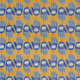 Detail of wallpaper in a playful hamsa hand print in blue, yellow and orange on a yellow field.