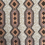 Patterned fabric with geometric design on a beige background