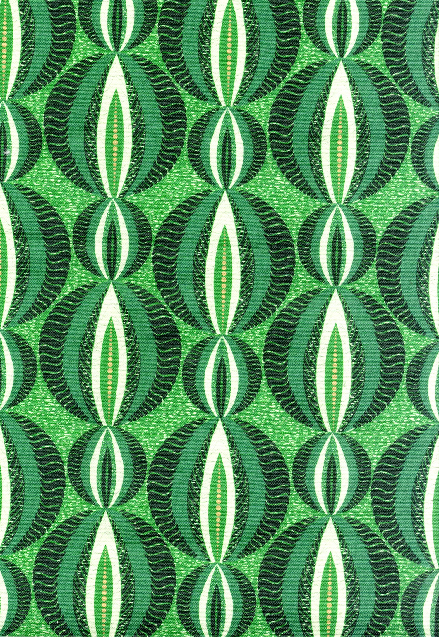 Detail of fabric in an interlocking circular stripe print in shades of green on a dark green field.