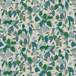 Detail of fabric in a minimal leaf print in shades of blue, green and pink on a tan field.