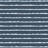 Detail of wallpaper in an undulating stripe pattern in blue, white and navy.