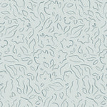 Detail of wallpaper in a minimalist floral print in navy on a turquoise field.