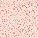 Detail of wallpaper in a painterly floral print in rust and white on a light pink field.