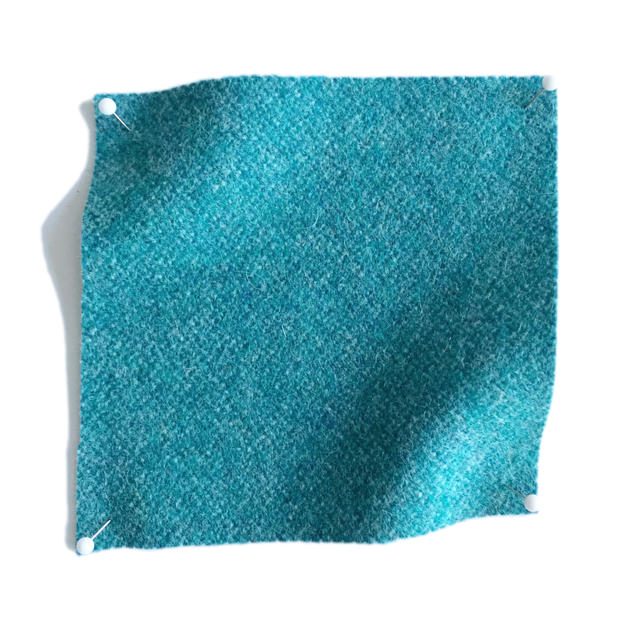 Square fabric swatch of wool in a turquoise colorway.