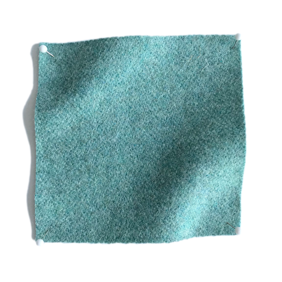Square fabric swatch of wool in a light turquoise colorway.