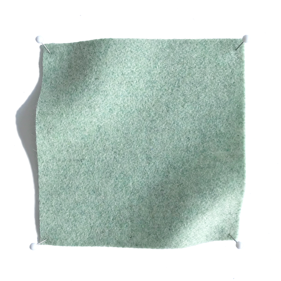 Square fabric swatch of wool in a blue-green colorway.