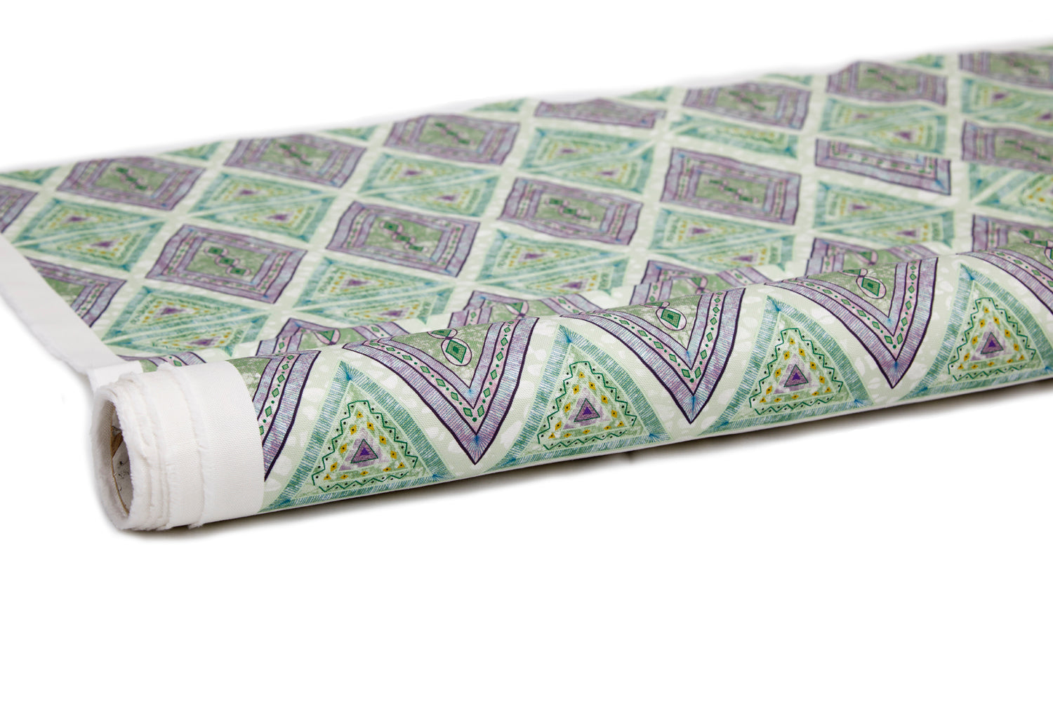 Partially unrolled fabric in an intricate diamond grid pattern in shades of green and purple.