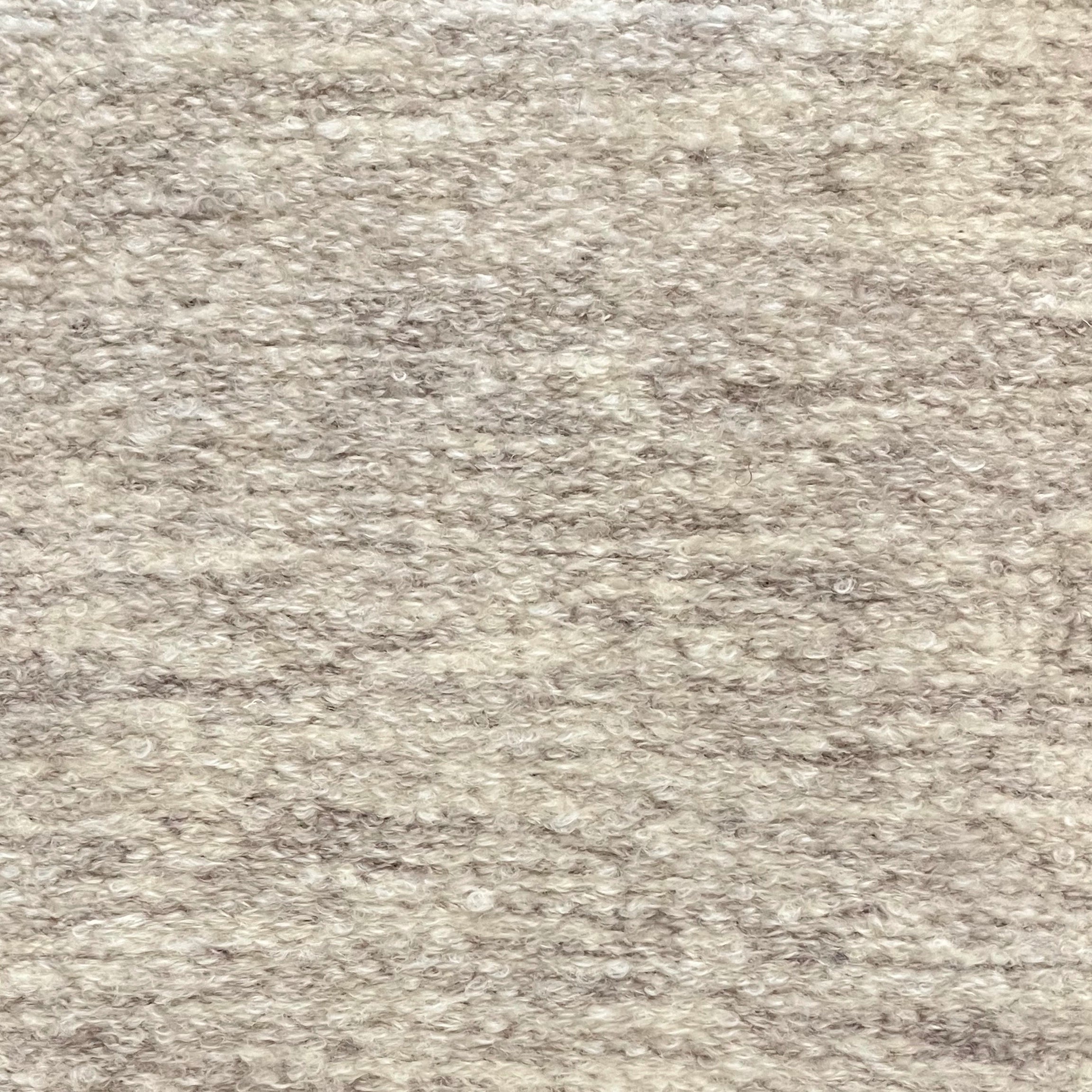 Textural bouclé broadloom carpet in soft taupe.